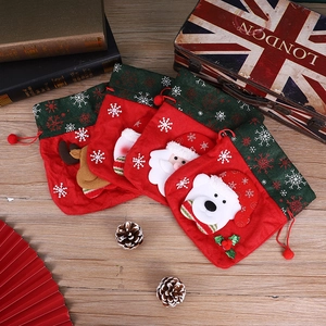 Set of 4 Christmas drawstring gift bags featuring Santa, snowman, elk and polar bear patterns
