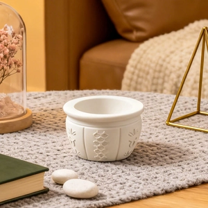 Detail of round bowl silicone mold with embossed texture on a cozy knit blanket