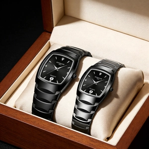 Detail view of pair of black square quartz watches with calendars in a wooden gift box