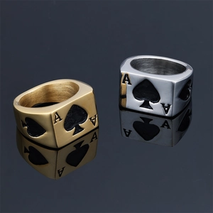 Detailed view of Ace of Spades poker rings in gold and silver stainless steel finishes