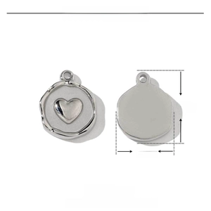 Macro view of stainless steel heart pendant showing 15mm dimensions and polished texture