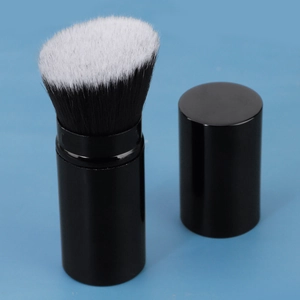 Portable retractable foundation brush with black tube and dual-color synthetic bristles