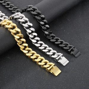 Detailed trio of gold, silver, and black stainless steel Cuban link chains with clasps