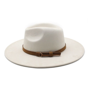 Detailed texture of off-white wide brim fedora with brown suede band and metal ring