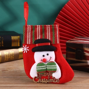 Detail of red Christmas stocking with 3D snowman and gold Merry Christmas embroidery