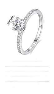 Detail view of S925 sterling silver six-prong moissanite ring with side accent stones