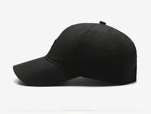 Detail view of black breathable quick-dry baseball cap featuring laser-cut ventilation holes