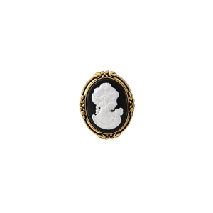 Detailed close-up of a vintage cameo brooch featuring an elegant white relief on black