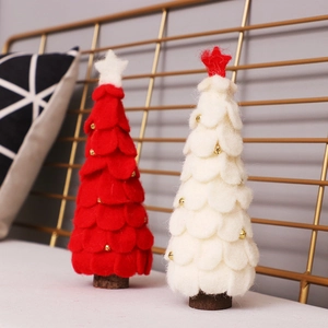 Handcrafted wool felt Christmas trees in red and white with stars on wooden bases