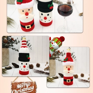 Detail of knitted Santa and Snowman wine bottle covers with festive pine cone decor
