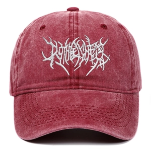 Detail of silver gothic embroidery on burgundy washed cotton baseball cap with vintage finish