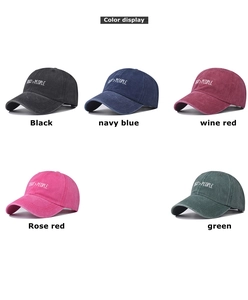 Matrix view of washed cotton baseball caps in five colors with white embroidered text