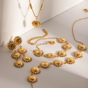 Detailed view of 18k gold plated sunflower necklace, bracelet and earrings set