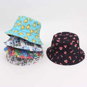 Reversible graffiti bucket hat with colorful mushroom and duck patterns for sun protection