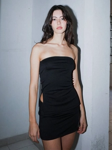 Chic black two-piece set featuring a cutout tube top and slim-fit mini skirt on model