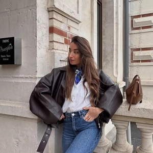 Oversized dark brown leather jacket with belt in retro American streetwear style