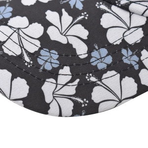 Detailed macro view of cotton floral print fabric and reinforced triple stitching