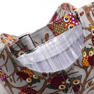 Detail view of owl print baseball cap showing grey fabric and metal adjustable strap
