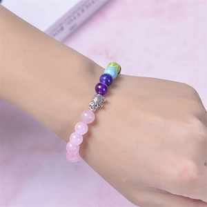 Colorful natural stone beaded yoga bracelet with silver elephant charm on female wrist