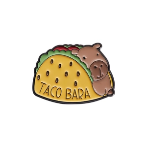 Cute Capybara taco enamel pin featuring cartoon animal design with TACO BARA text