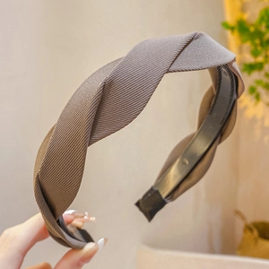 Close-up of brown twist knot headband featuring premium twill fabric texture and design