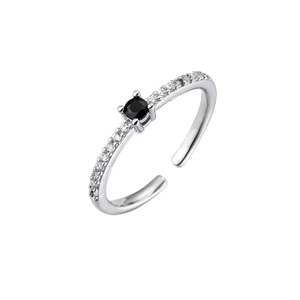 Macro detail of silver adjustable ring featuring a black round zircon and pave setting