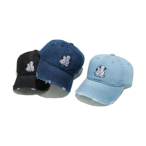 Denim baseball caps with Dalmatian embroidery in black, dark blue, and light blue