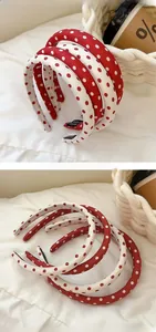Detail showing red and white polka dot sponge headbands with handmade inner lining tags