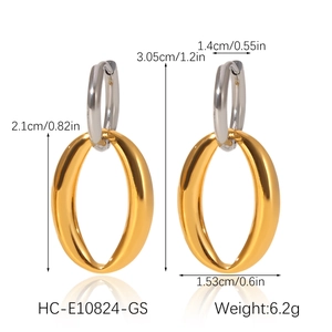 Detail view of mixed gold and silver oval earrings with precise size measurements