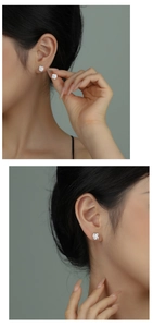 Close-up of silver twist earrings with round cubic zirconia on a model