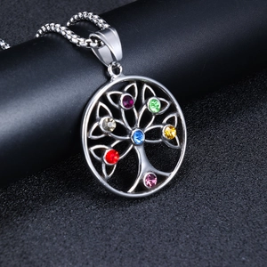 Macro shot of Viking Tree of Life pendant with vibrant multi-colored rhinestones and steel chain
