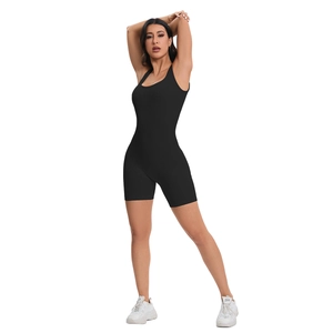 Detail of black seamless ribbed yoga romper with U-neck and bodycon fit shorts