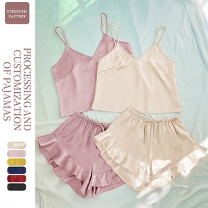Women's silk satin pajama set with V-neck camisole top and ruffled hem shorts