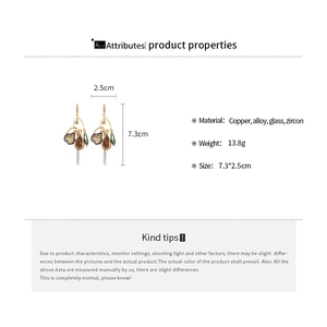 Detailed view of luxury geometric teardrop earrings with dimensions and material specs
