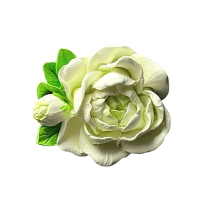 White jasmine flower car air vent aromatherapy clip with green leaves and a bud
