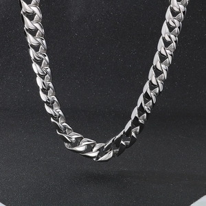 Macro shot of 15mm silver stainless steel Cuban link chain necklace for men