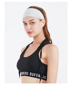 Detail view of seamless elastic gray headband paired with a black running tank top