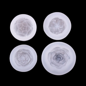 Detailed white silicone molds featuring intricate floral textures for candle making