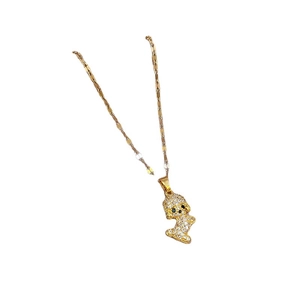 Luxurious gold-plated necklace with a sparkling pavé crystal dog pendant on white background