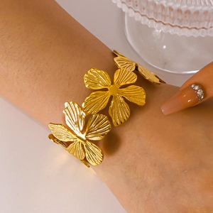 Adjustable gold plated textured floral cuff bracelet in high quality stainless steel