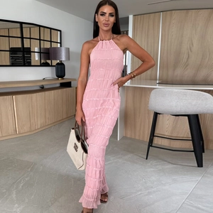 Detail showing the pleated pink fabric and high neck strap of this elegant backless dress