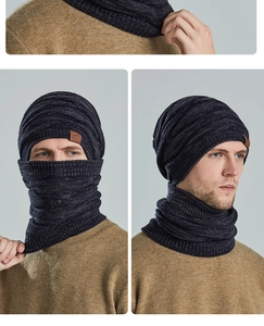 Detailansicht von dunkelblauem Strickmützen- und Schal-Set mit braunem Lederaufnäher
