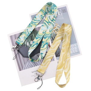 Detail view of marble patterned lanyards with metal clasps in blue and yellow