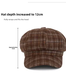 Detail shot of brown plaid newsboy cap showing the 12cm deep crown and textured fabric