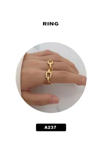 Close-up of minimalist 18k gold plated chain ring with industrial oval link design