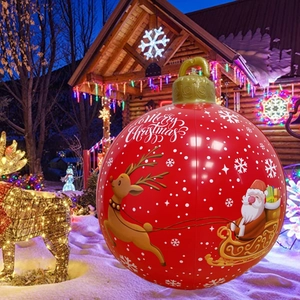 Large red inflatable Christmas ball with Santa and reindeer patterns for outdoor decor