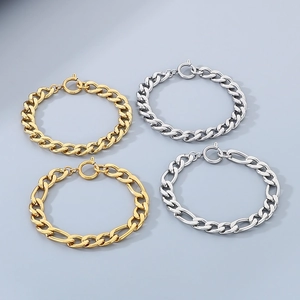 Flat lay of gold and silver Figaro and Cuban link chains with spring ring clasps
