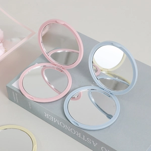 Portable folding compact makeup mirrors in pastel pink, blue, and beige colors