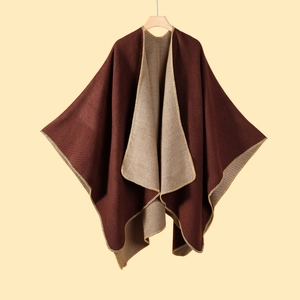 Detail of double-sided knit shawl showing brown and beige fabrics with stitched edges