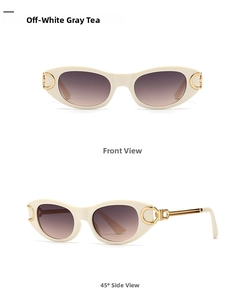 Detail view of oval cream sunglasses with gray-brown lenses and gold metal logo
